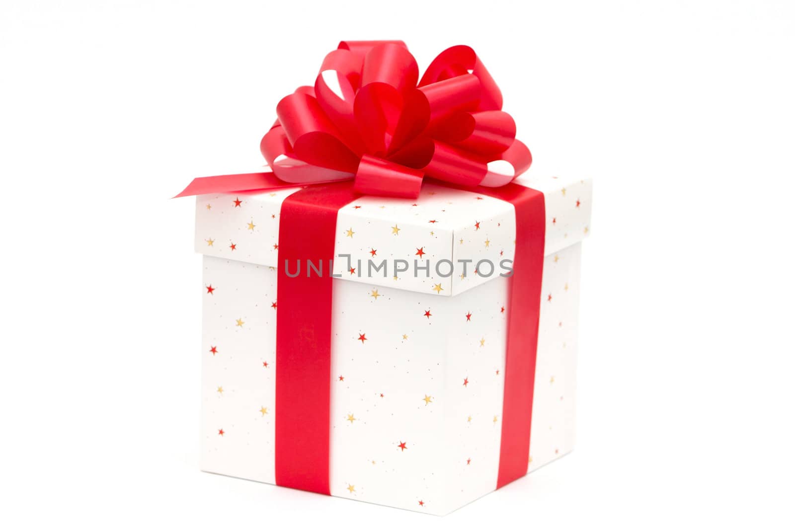 White gift box with red ribbon isolated on white