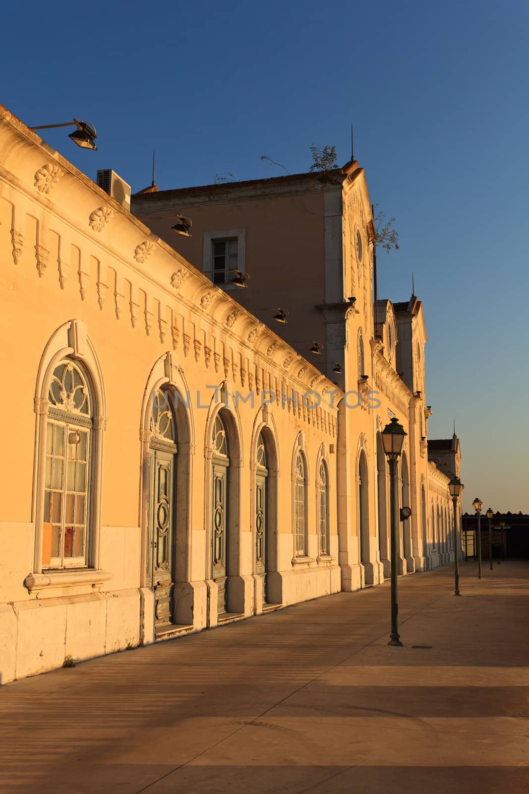 Old boats and train station in the city of Barreiro.