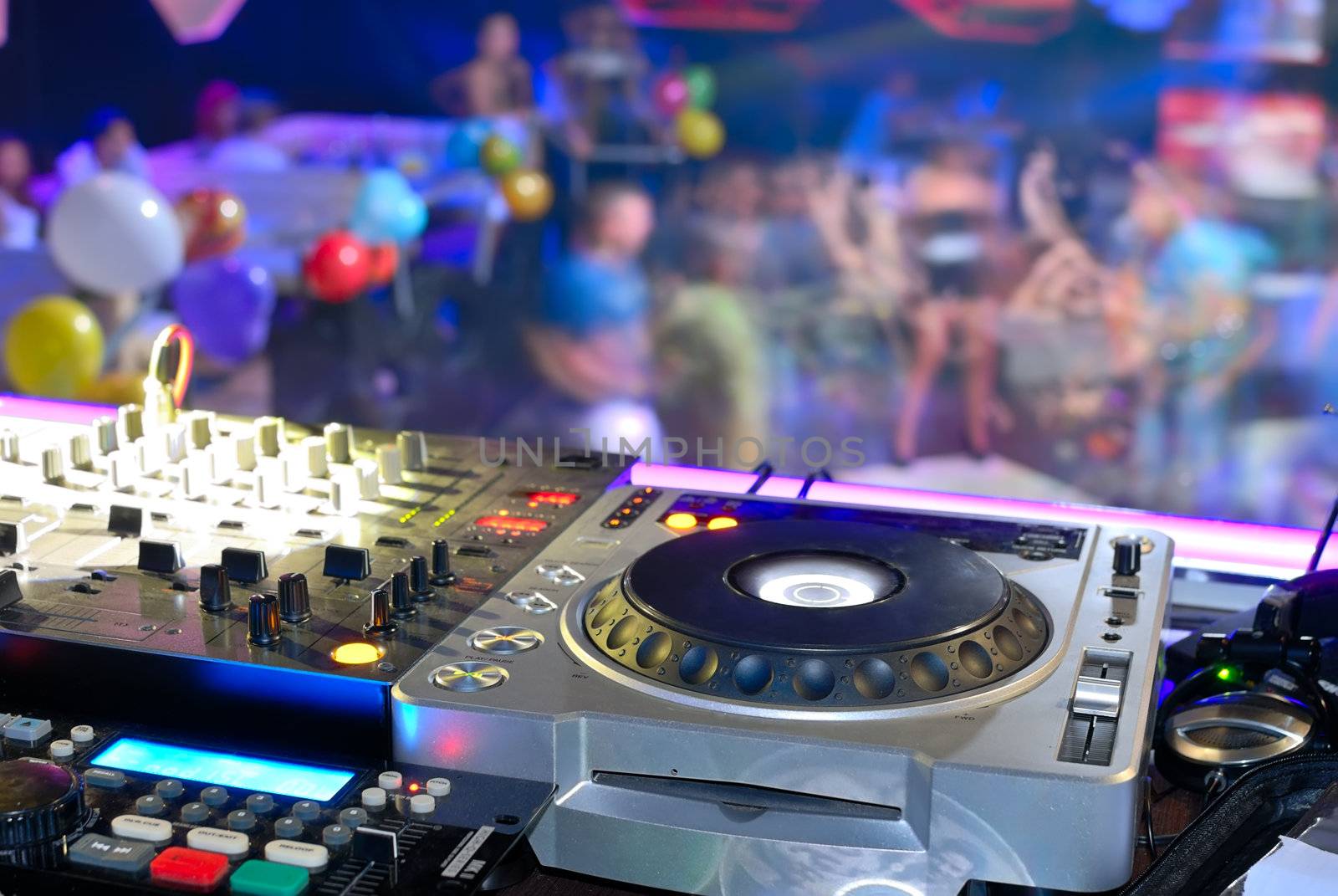 DJ's deck abothe the dancefloor, disco patry