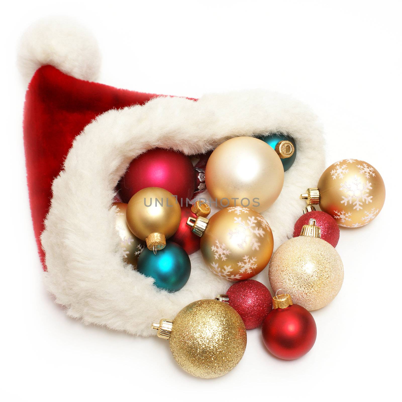 An overflowing santa hat filled with Christmas baubles.
