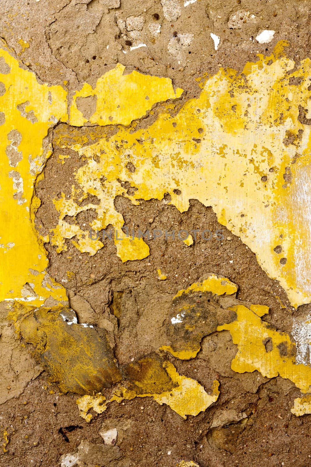 Close up view of a worn textured cement wall.