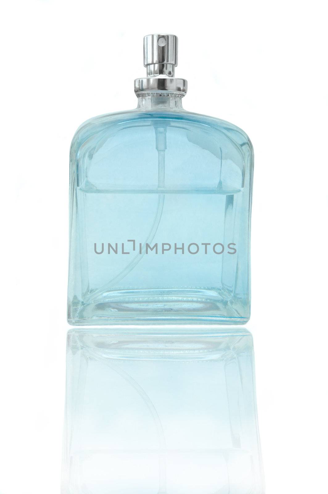A single glass blue perfume bottle arranged over white and reflecting into the foreground.