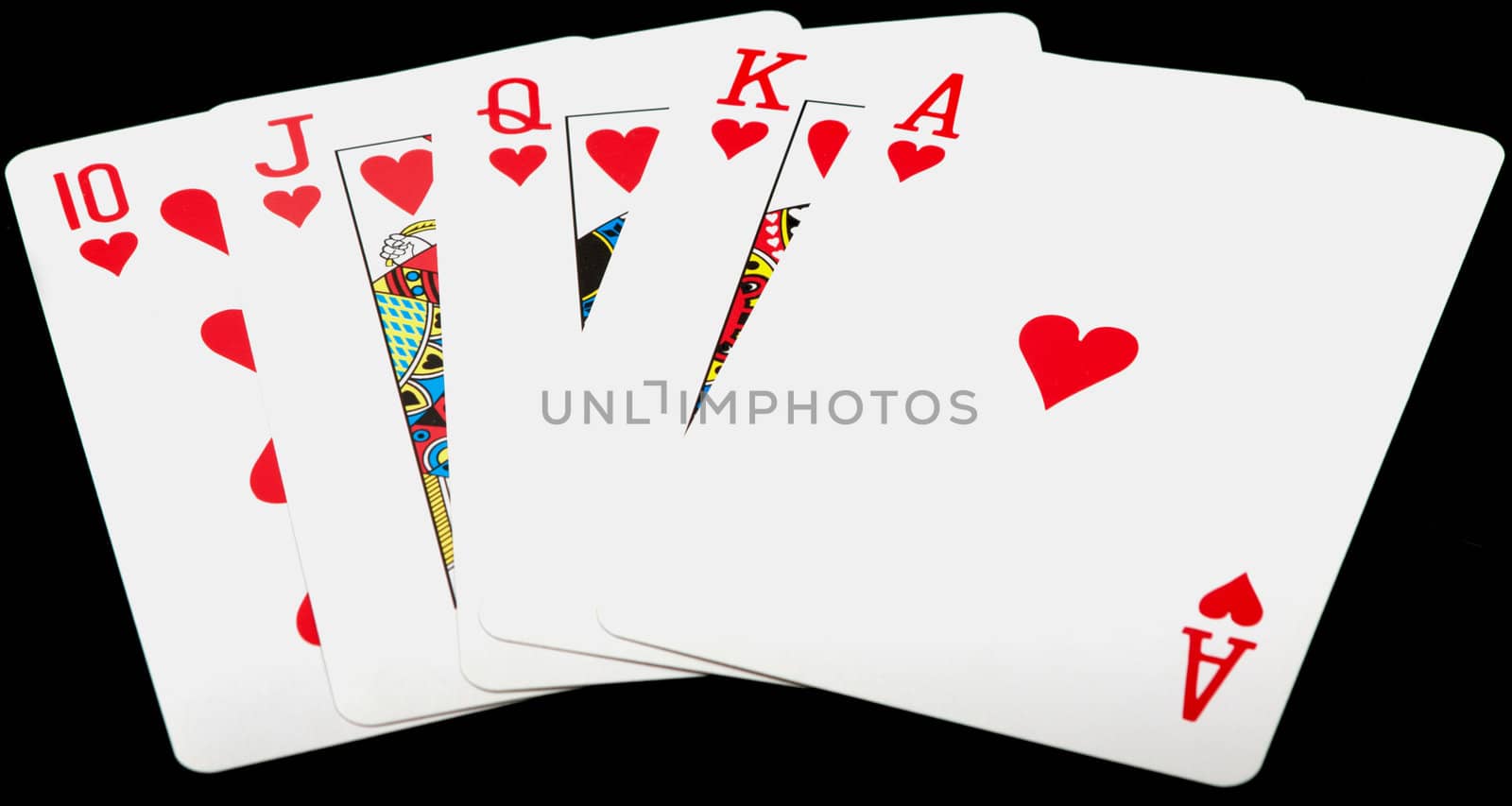 poker hand royal flush in hearts on black background