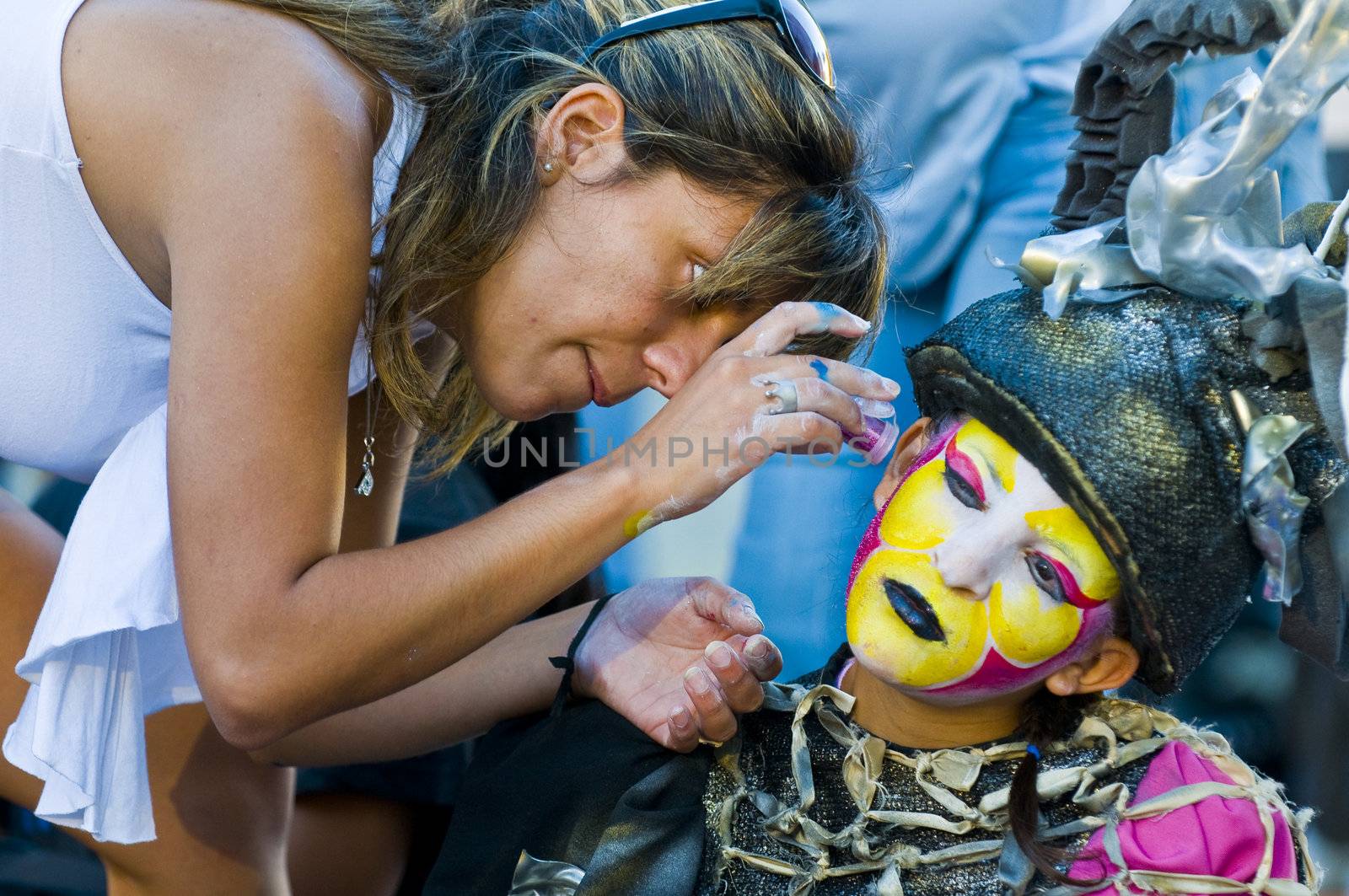 MONTEVIDEO, URUGUAY - JANUARY 28 : A carnaval participant has his face covered with makeup prior to participating in the annual national festival of Uruguay held in Montevideo Uruguay in January 28 201