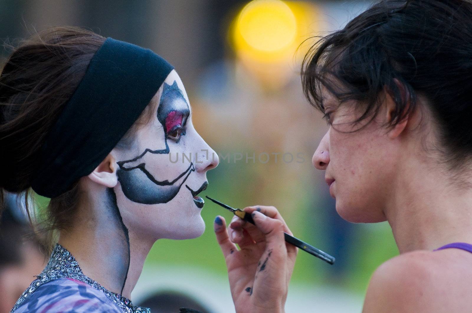 MONTEVIDEO, URUGUAY - JANUARY 28 : A carnaval participant has his face covered with makeup prior to participating in the annual national festival of Uruguay held in Montevideo Uruguay in January 28 201