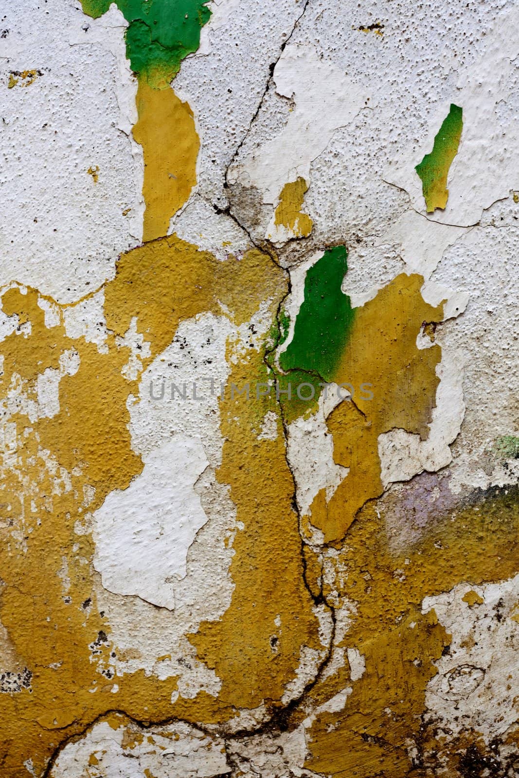 Close up view of a worn textured cement wall.