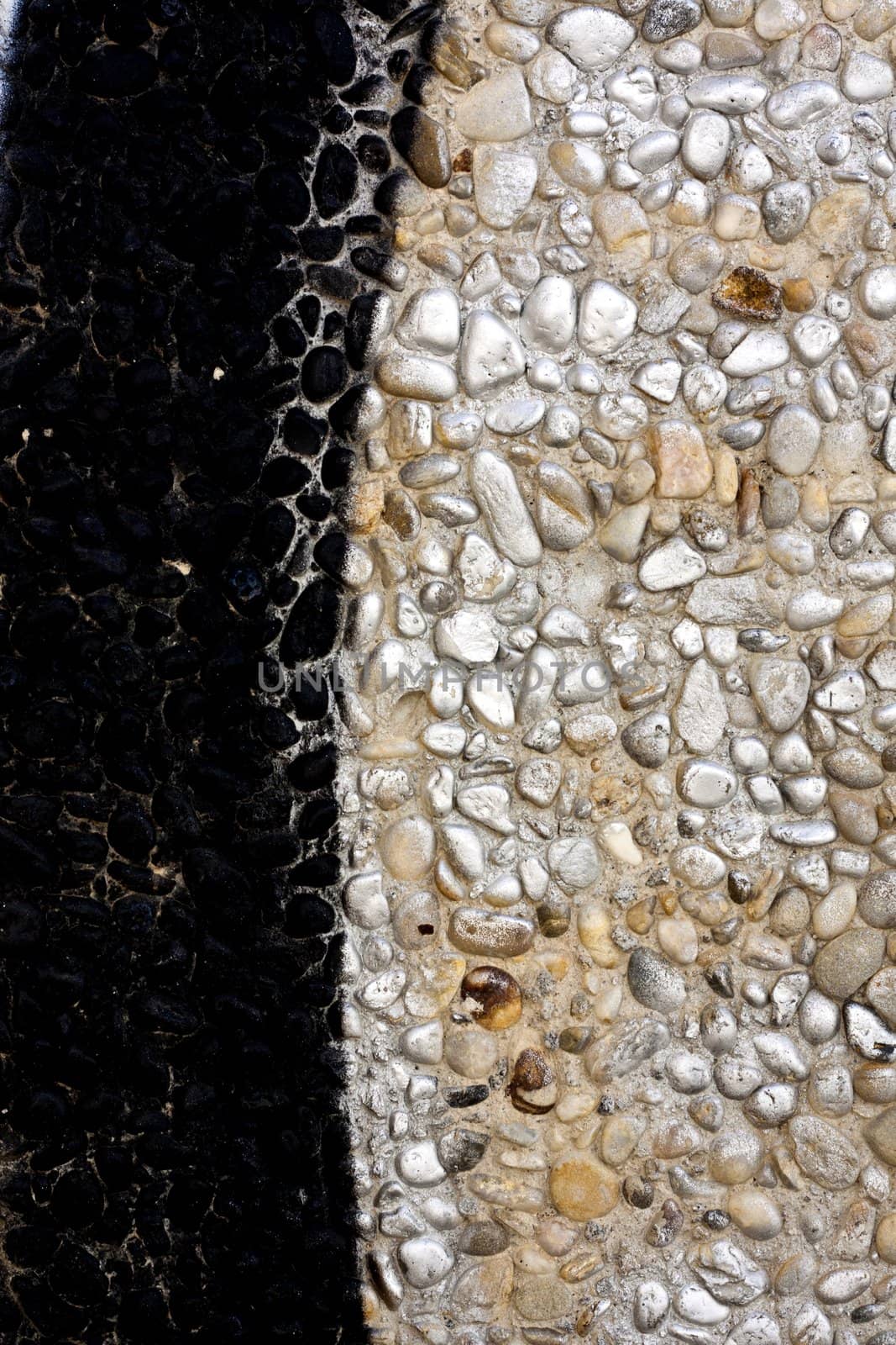 Close up view of a worn textured cement wall.