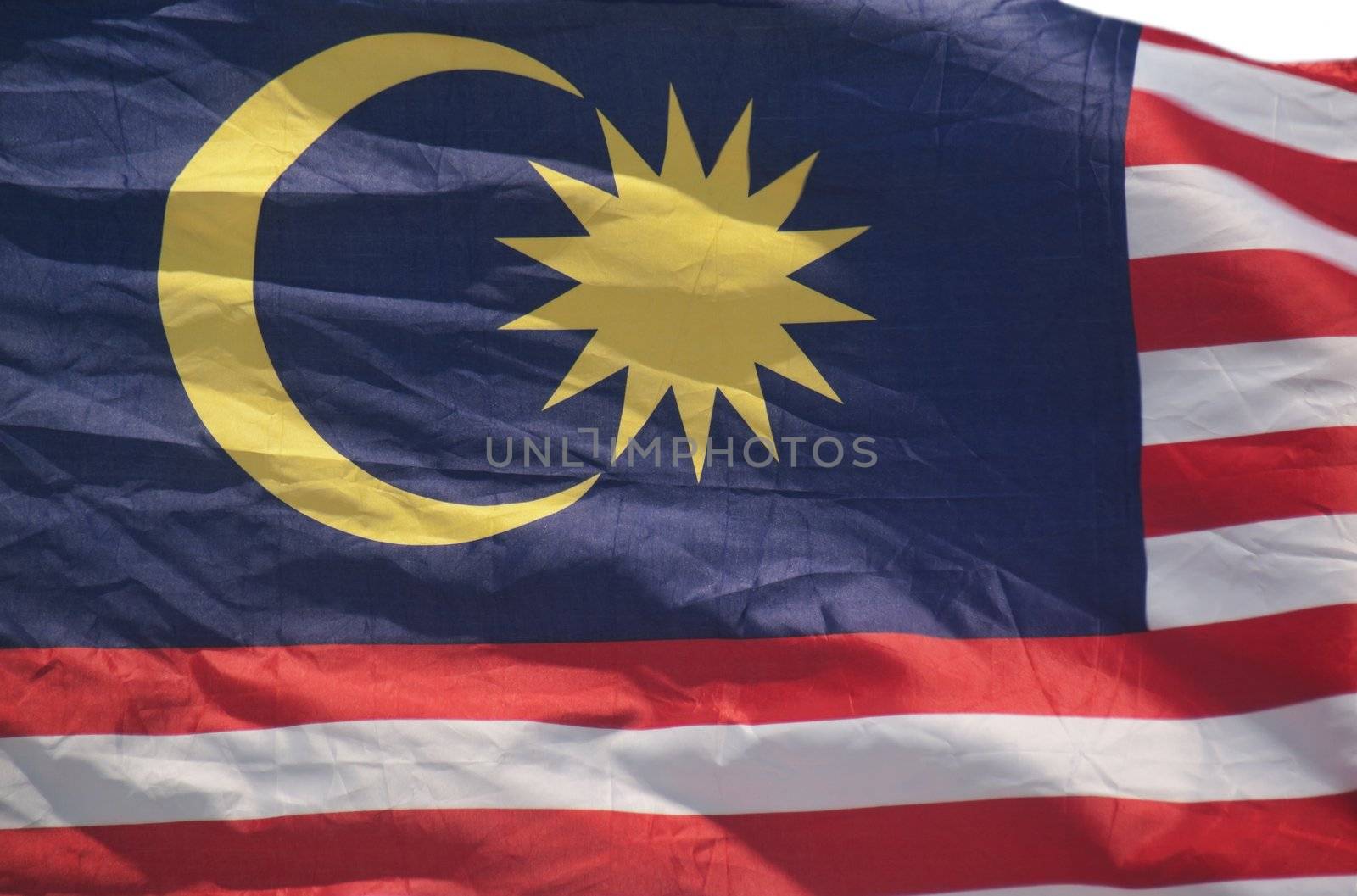 Malaysian flag waving with a strong wind