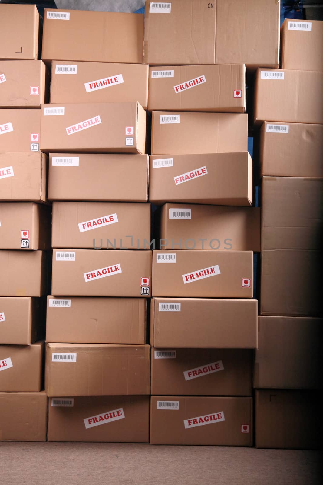 piles of cardboard boxes in Warehouse by photosoup
