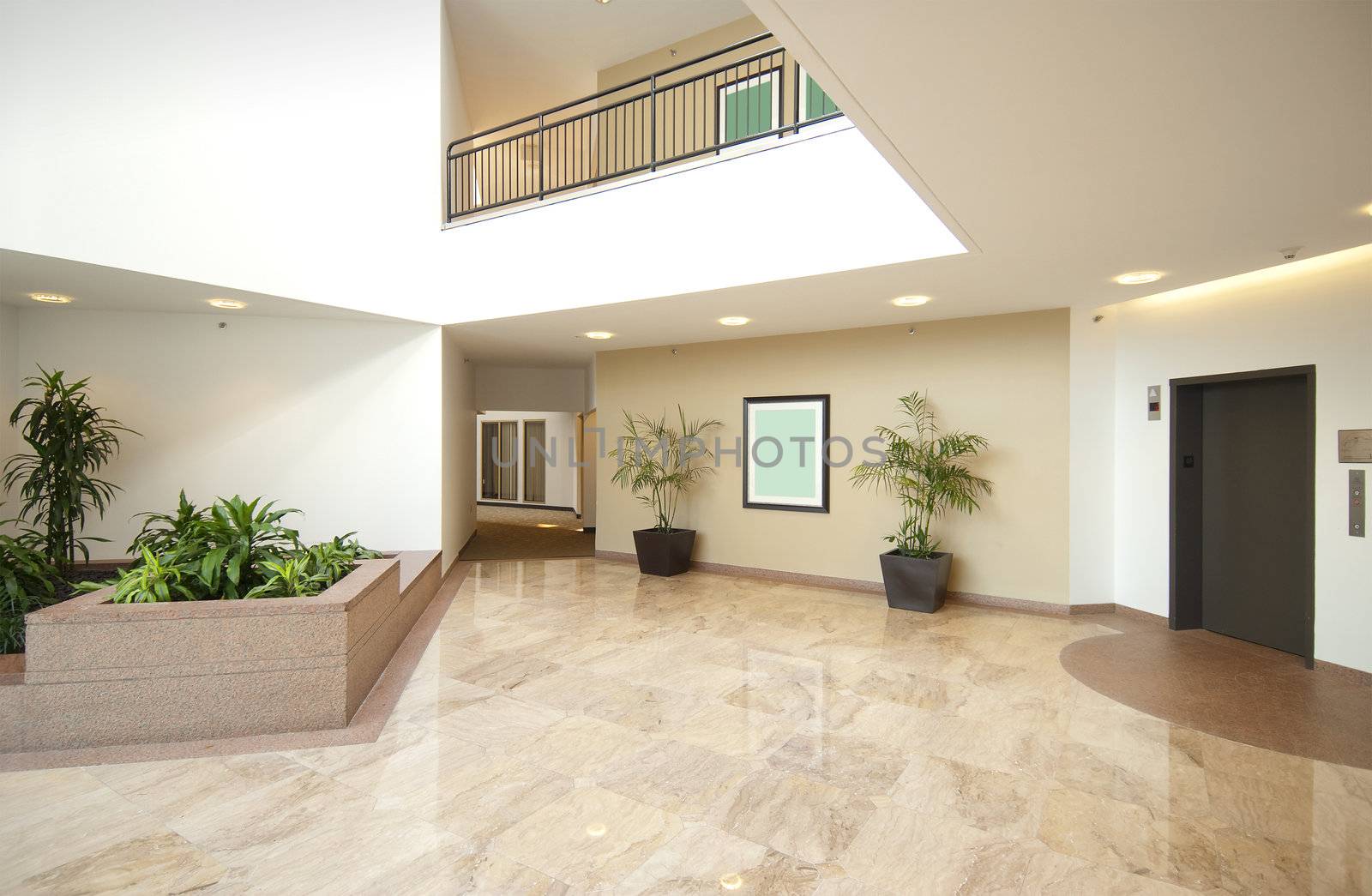 office building lobby in white and beige with marble floors