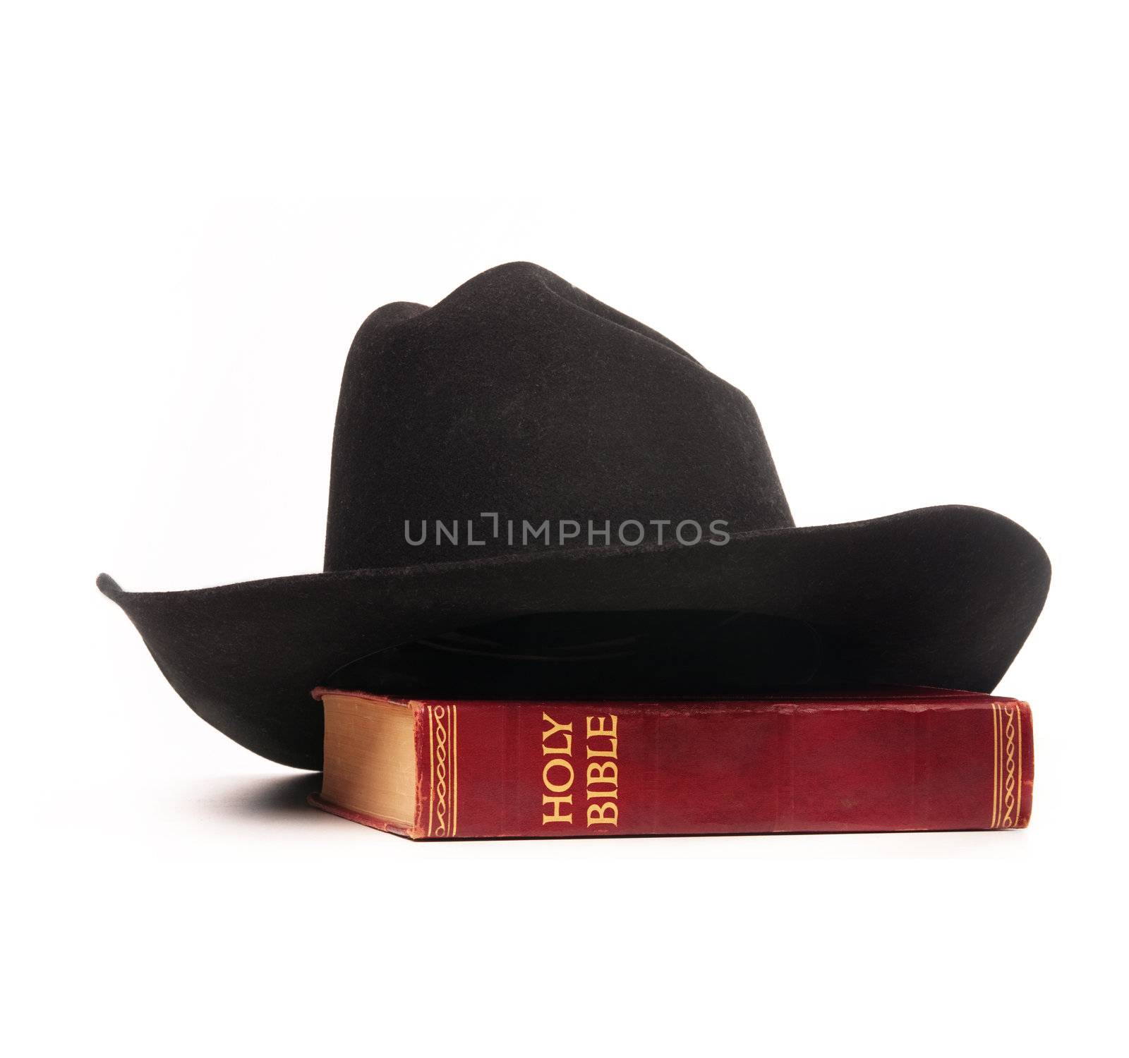 Cowboy hat and bible  by Paulmatthewphoto