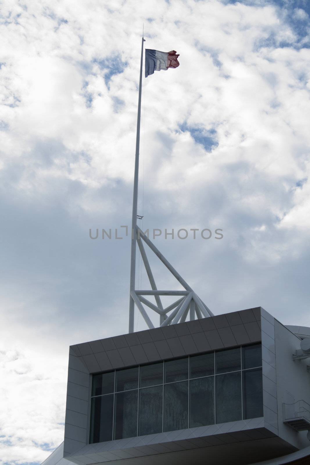 The french flag waving on the Centre Pompidou Metz, Lorraine, France.