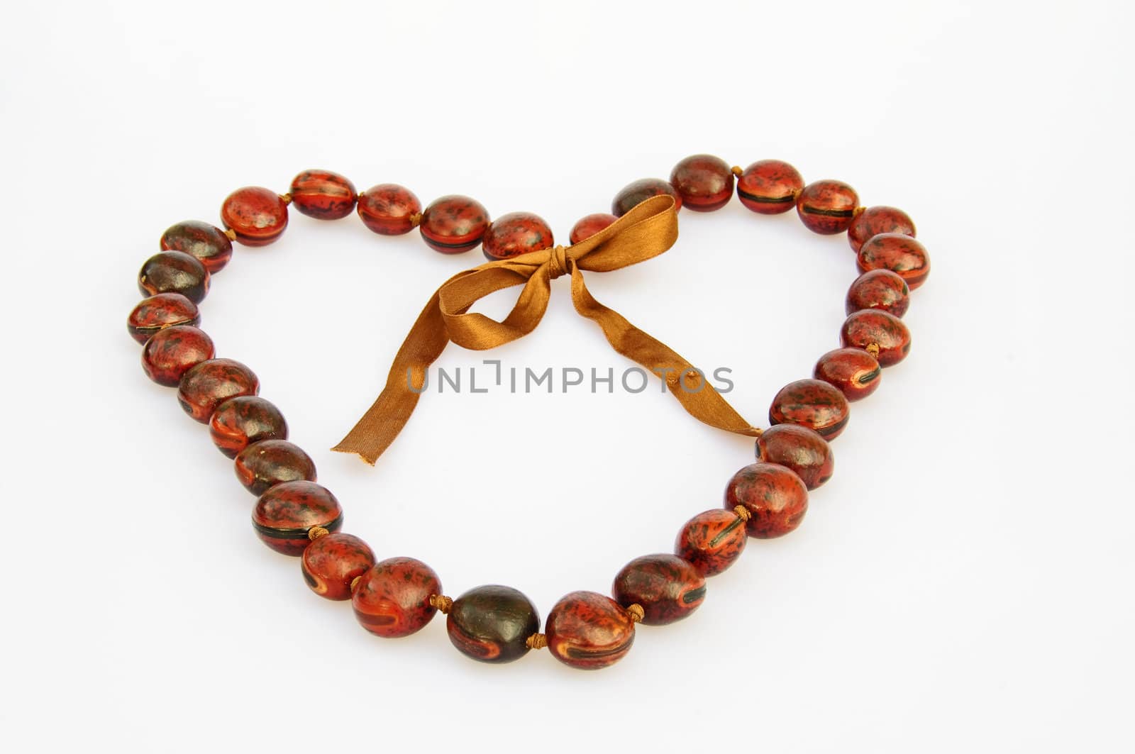 A necklace made of wood shaped like a heart