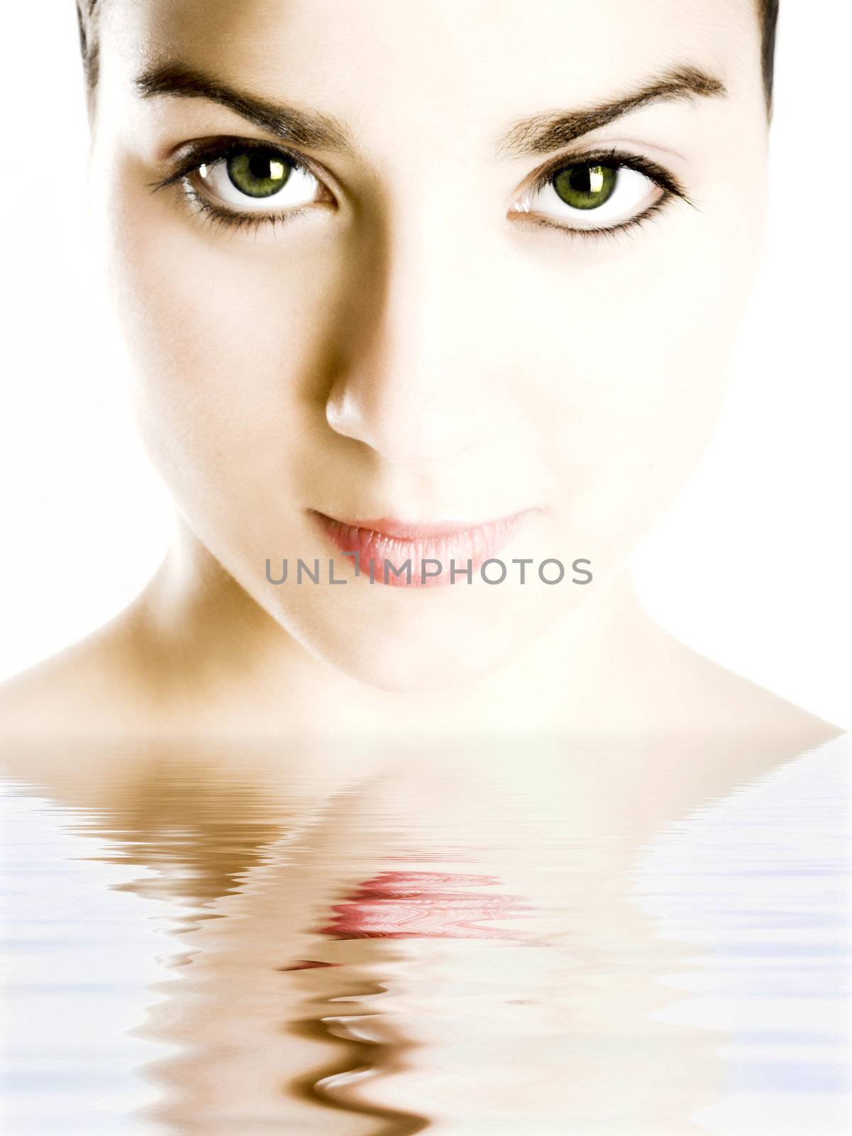 Portrait of a  beautiful woman with green eyes and reflection