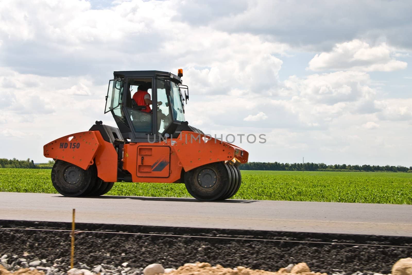 construction series: road-roller on the black asphalt