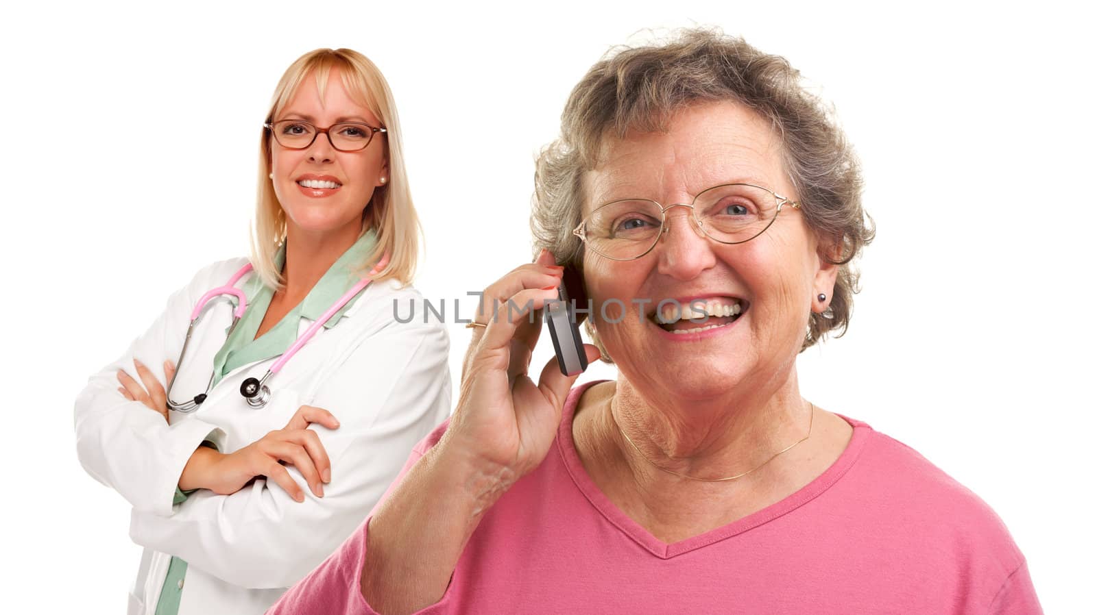 Senior Woman Using Cell Phone with Female Doctor Behind by Feverpitched
