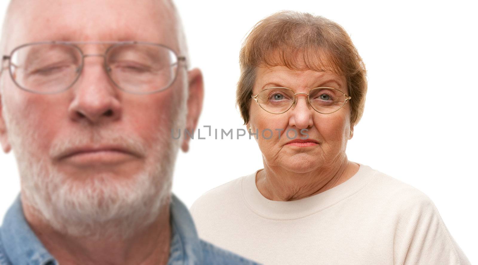 Concerned Senior Couple Isolated on White by Feverpitched