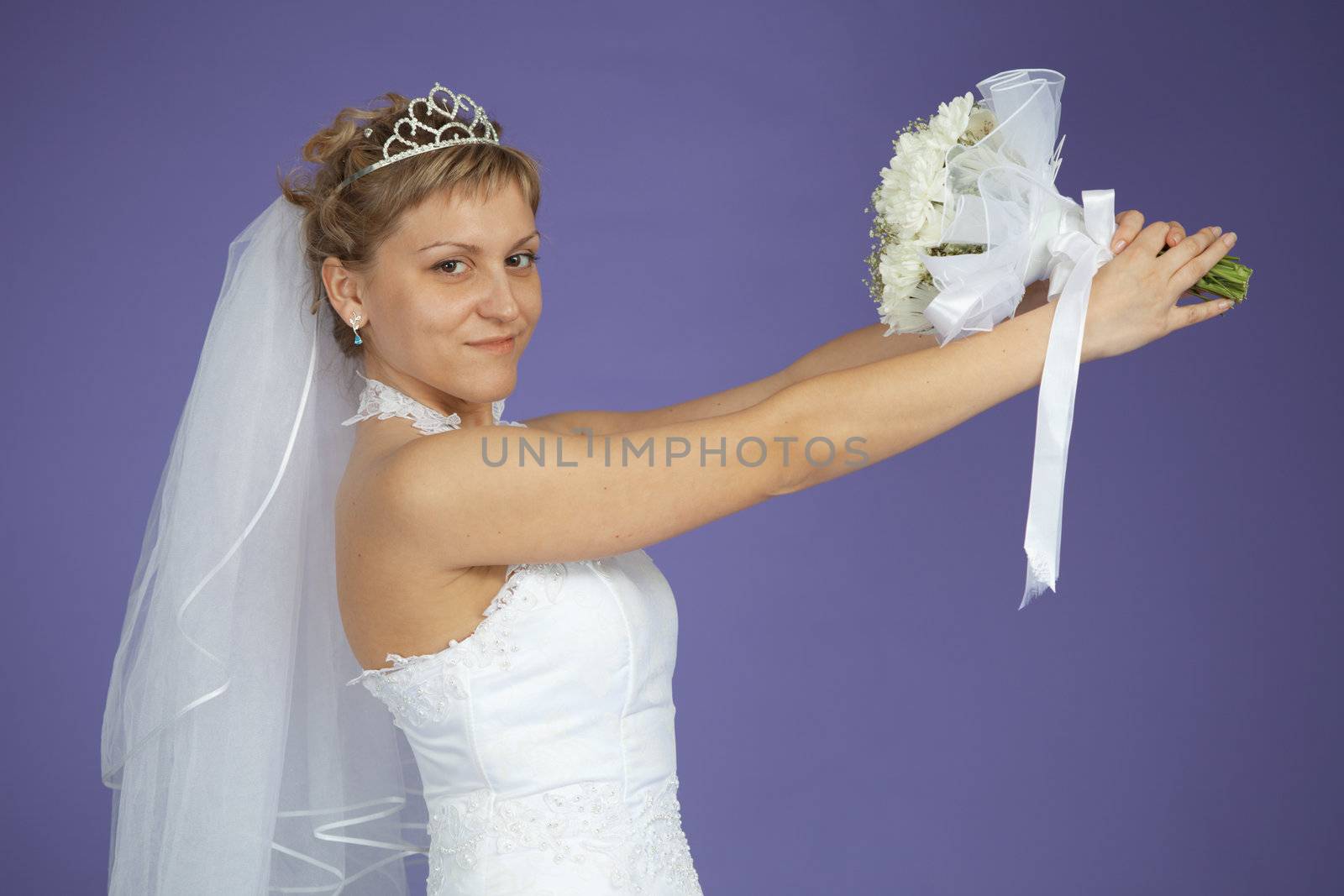 The bride is holding a wedding bouquet