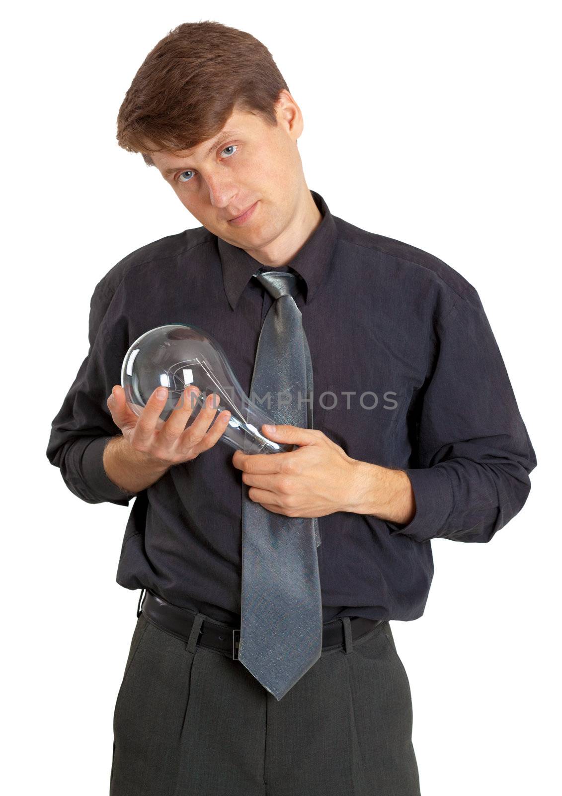 A man keeps on hand a large light bulb on white