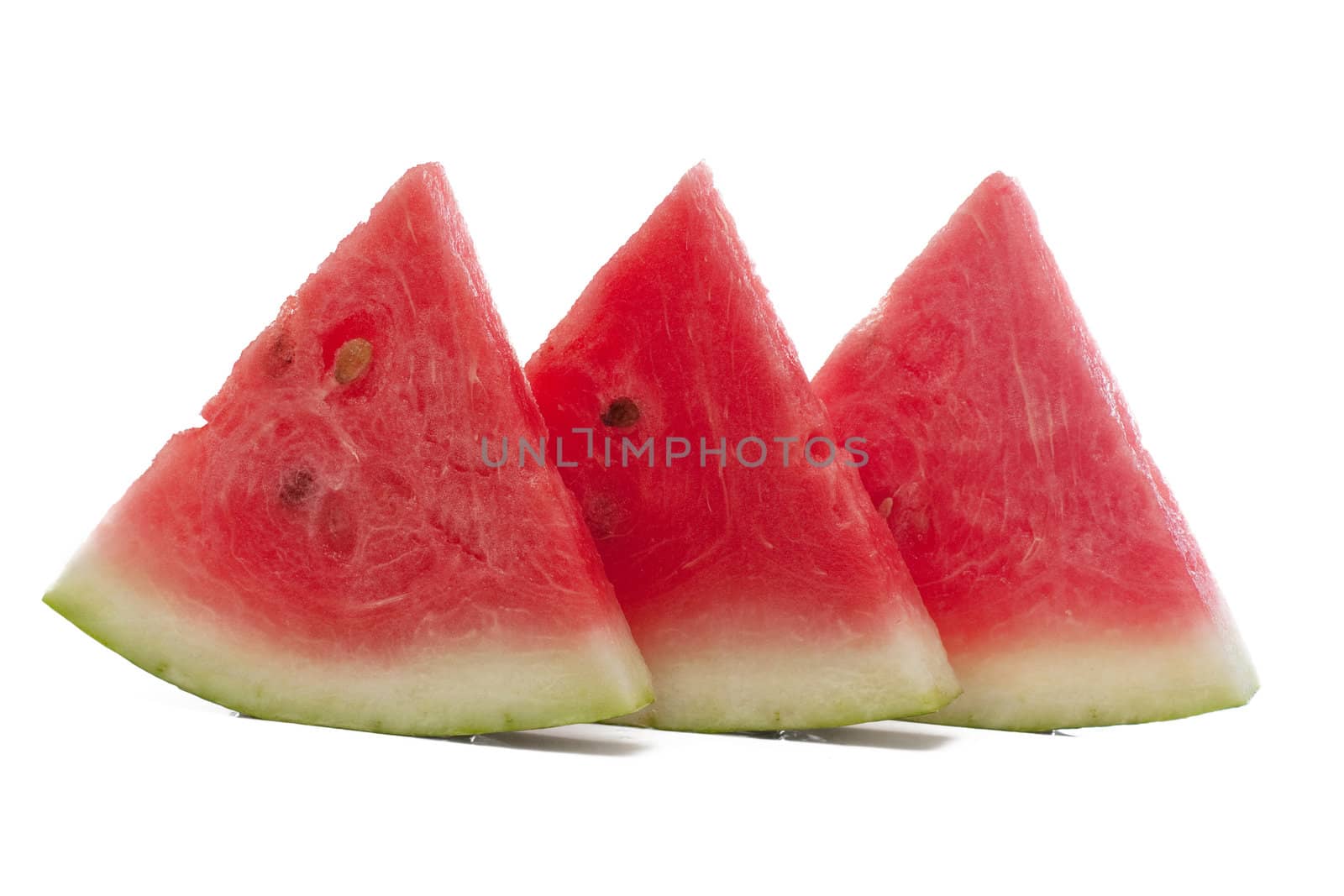 Three pieces of watermelon isolated over white.