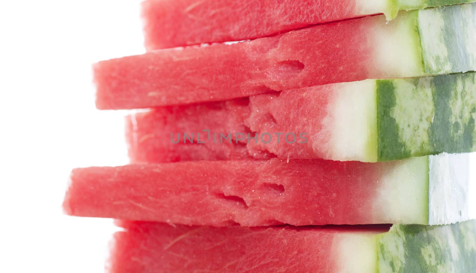 Five pieces of watermelon isolated over white.