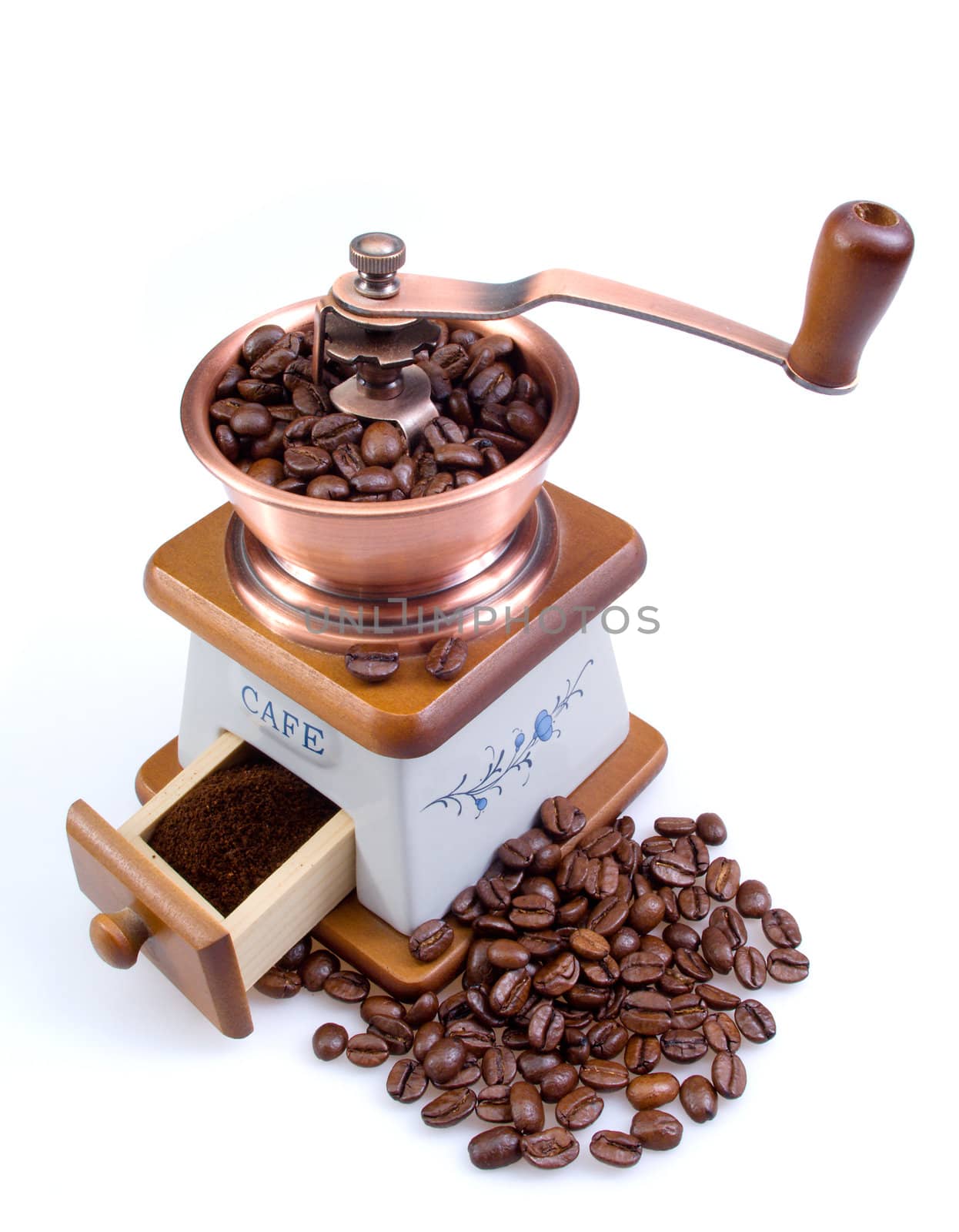 Old coffee grinder with coffee grains