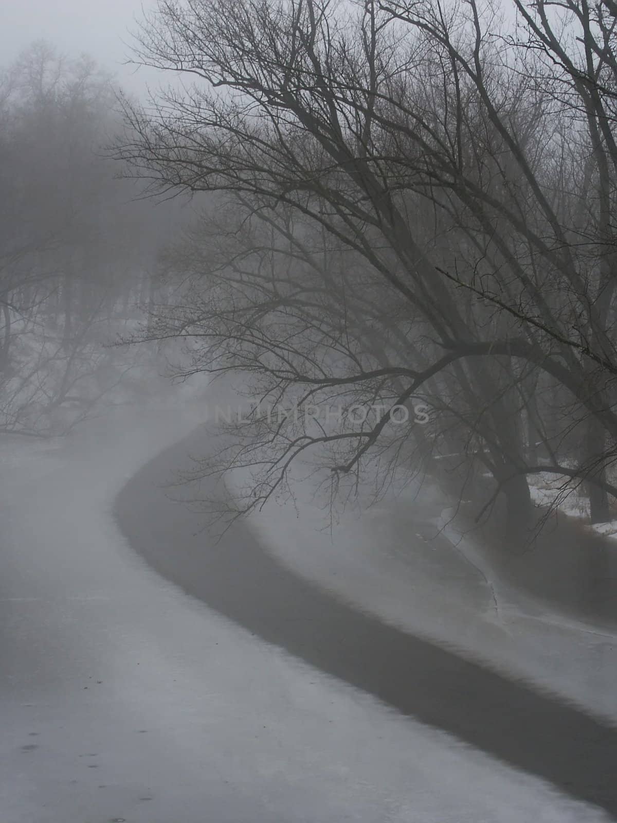 Dense fog over the icy Kishwaukee River in Illinois