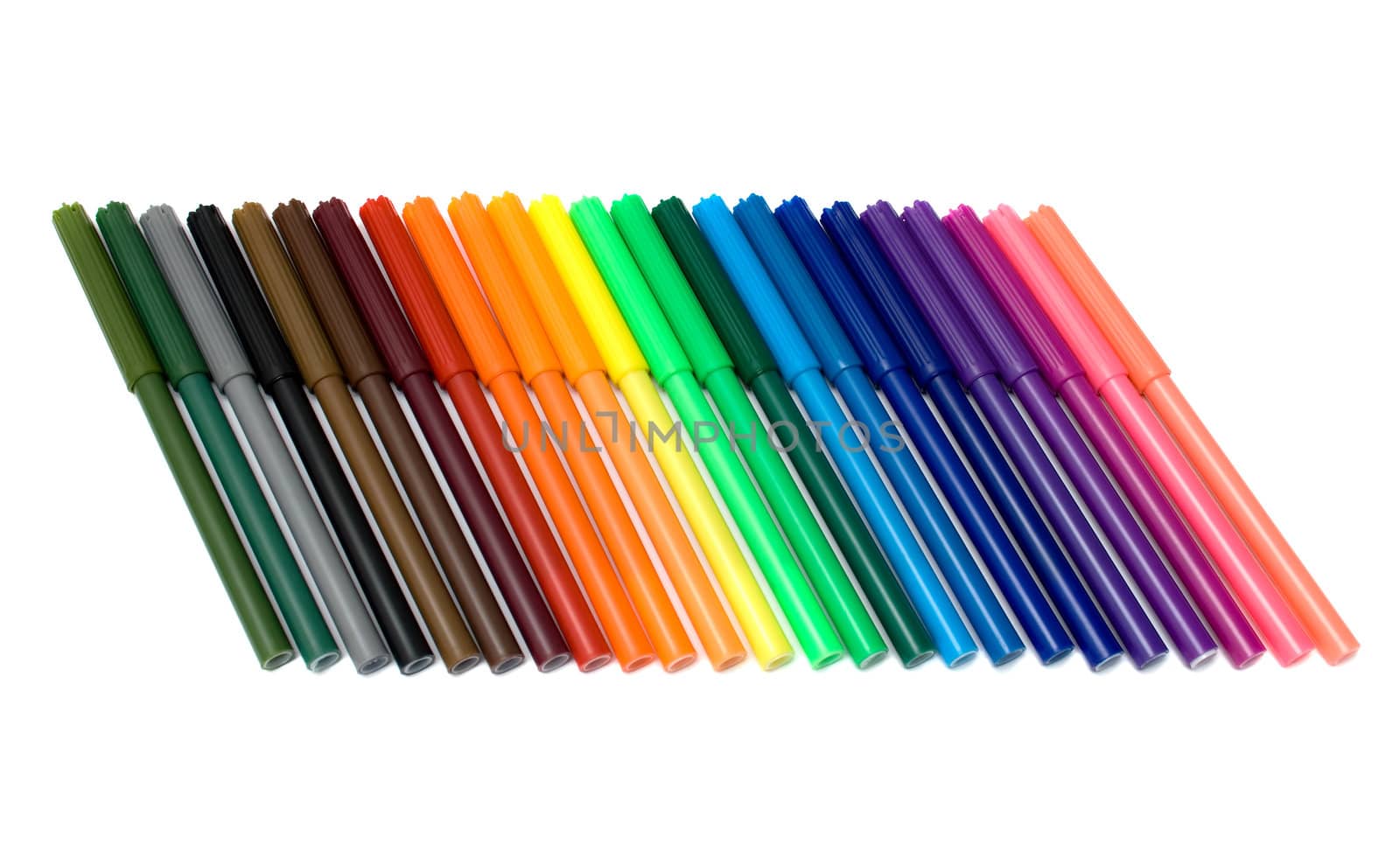 Colored felt tip pens in a row on white background