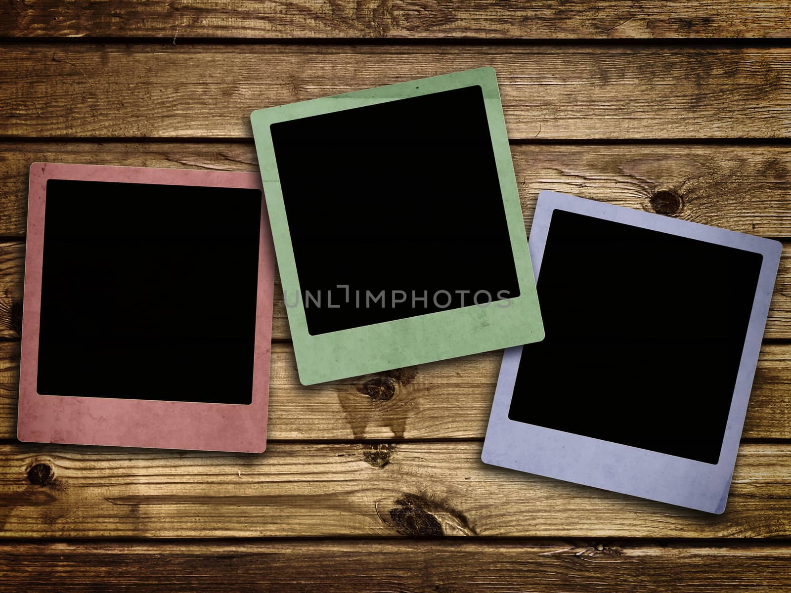 Photo of photo frames at abstract wooden background 