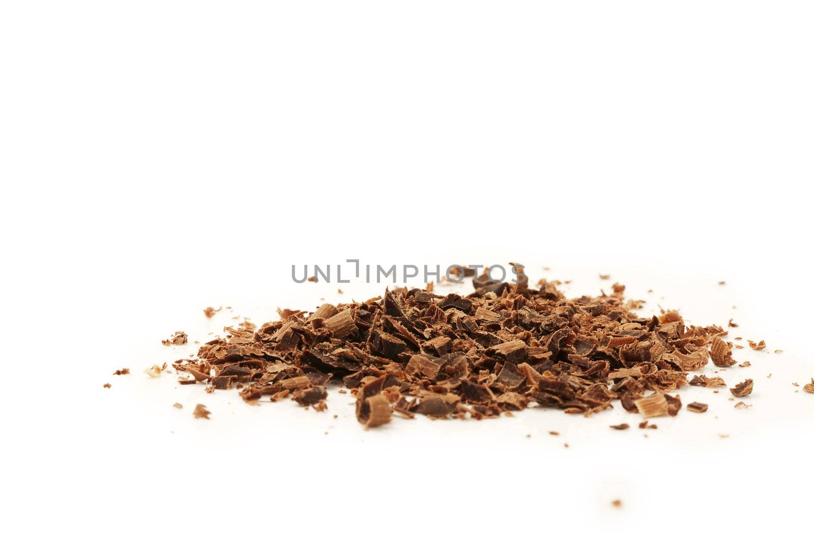 some chocolate crumbles on white background