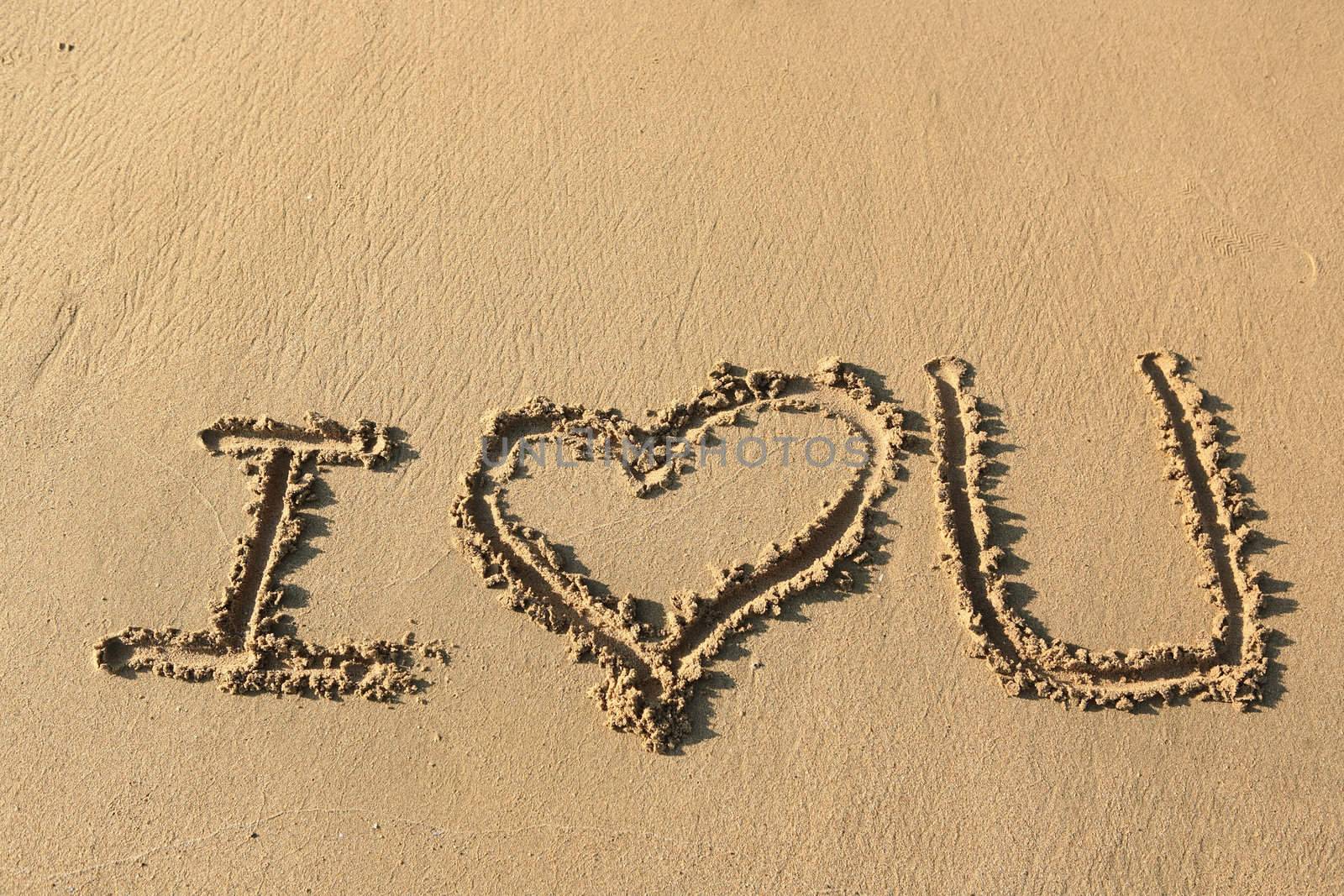 "I love you" drawing on the beach
