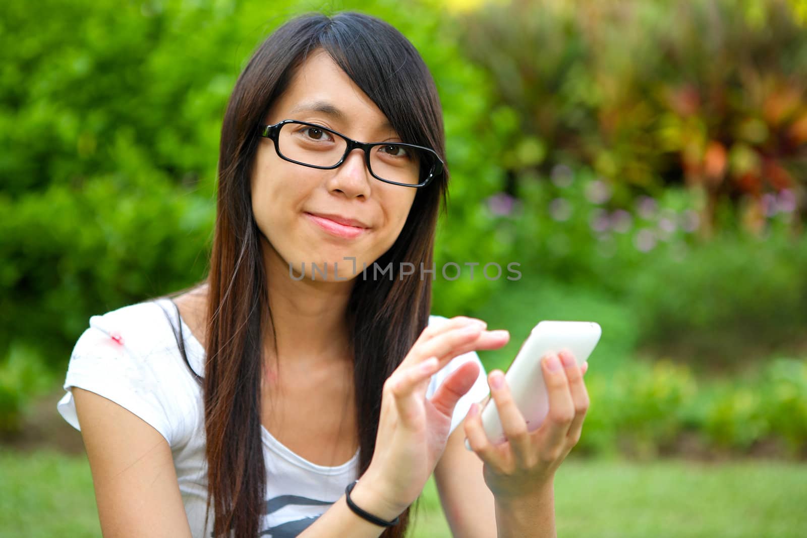 Beautiful young girl with pda outdoor by leungchopan