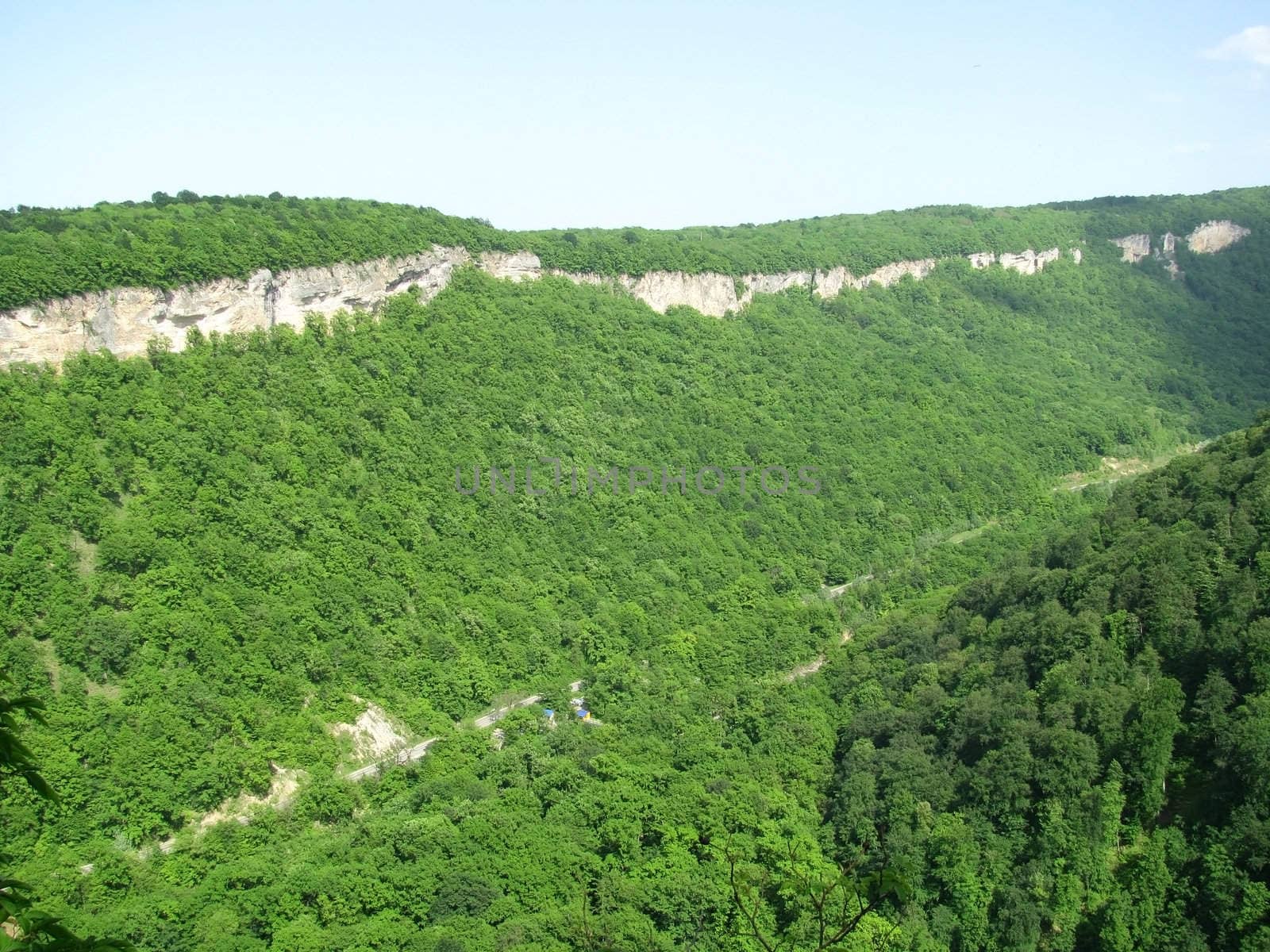 Greens; the Caucasian ridge; rocks; a relief; a landscape; a hill; a panorama; mountains; Caucasus; mountain; a slope