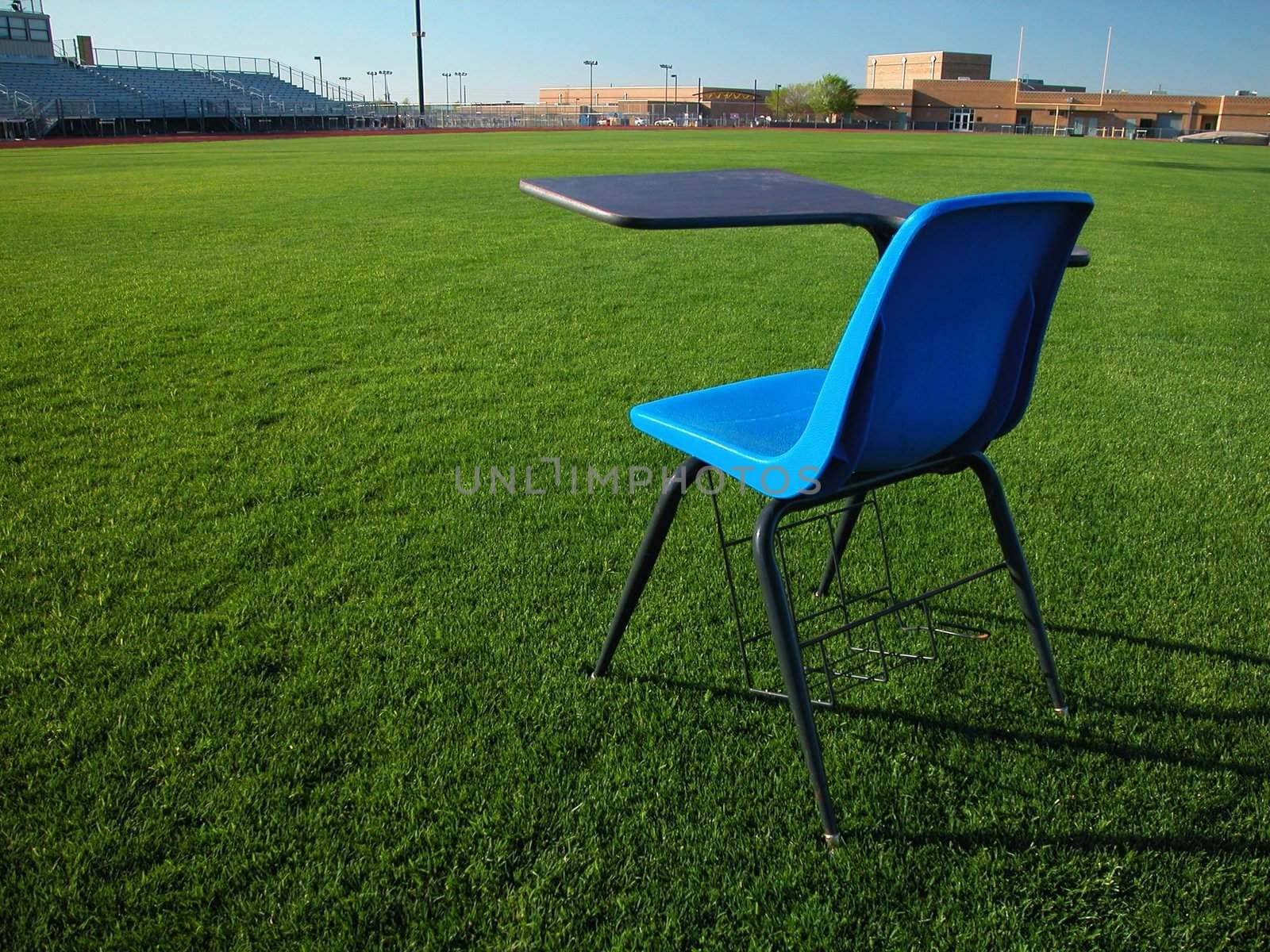 Blue Student Desk on Green Grass