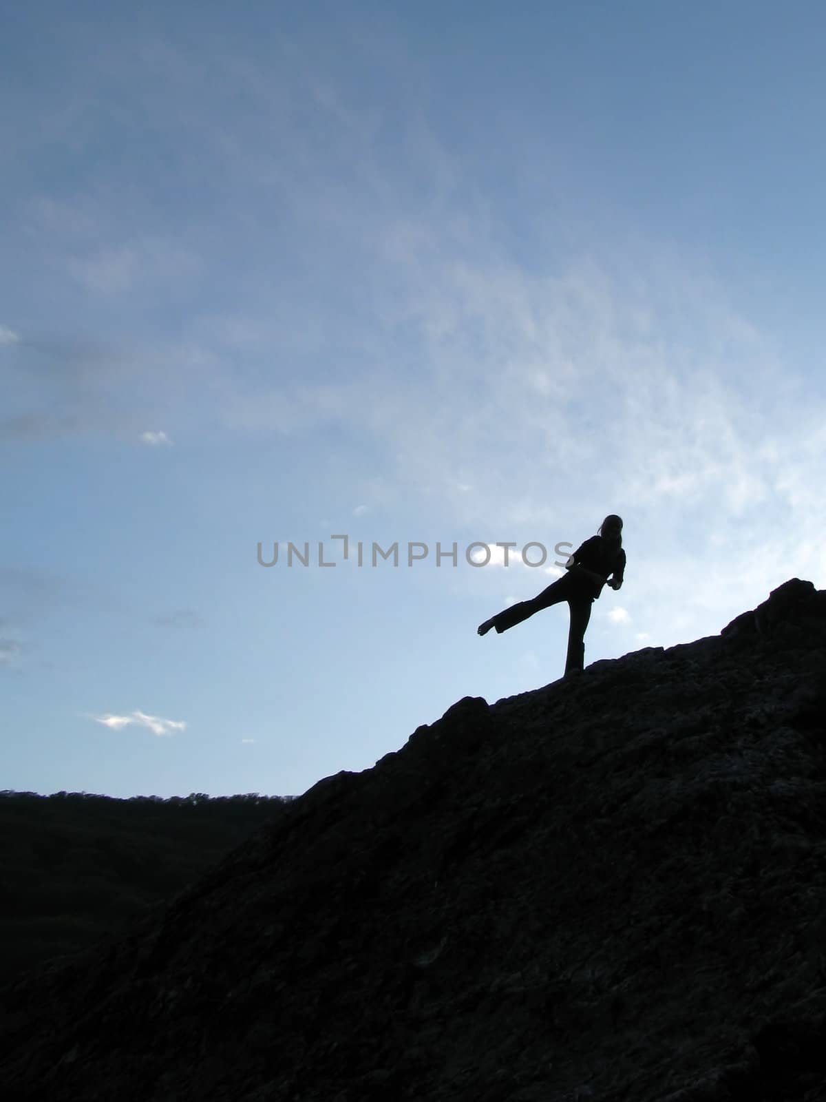 The sky, clouds, a rock, a stone, the person, a silhouette, people, trees, the nature, a landscape, a kind