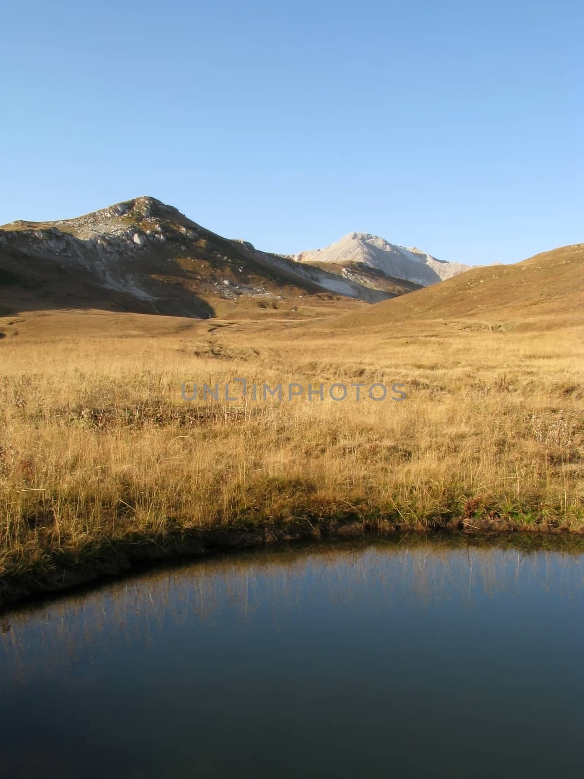 The nature; caucasus; mountains; top; a ridge; a panorama; a landscape; lake; water; a reservoir; peaks