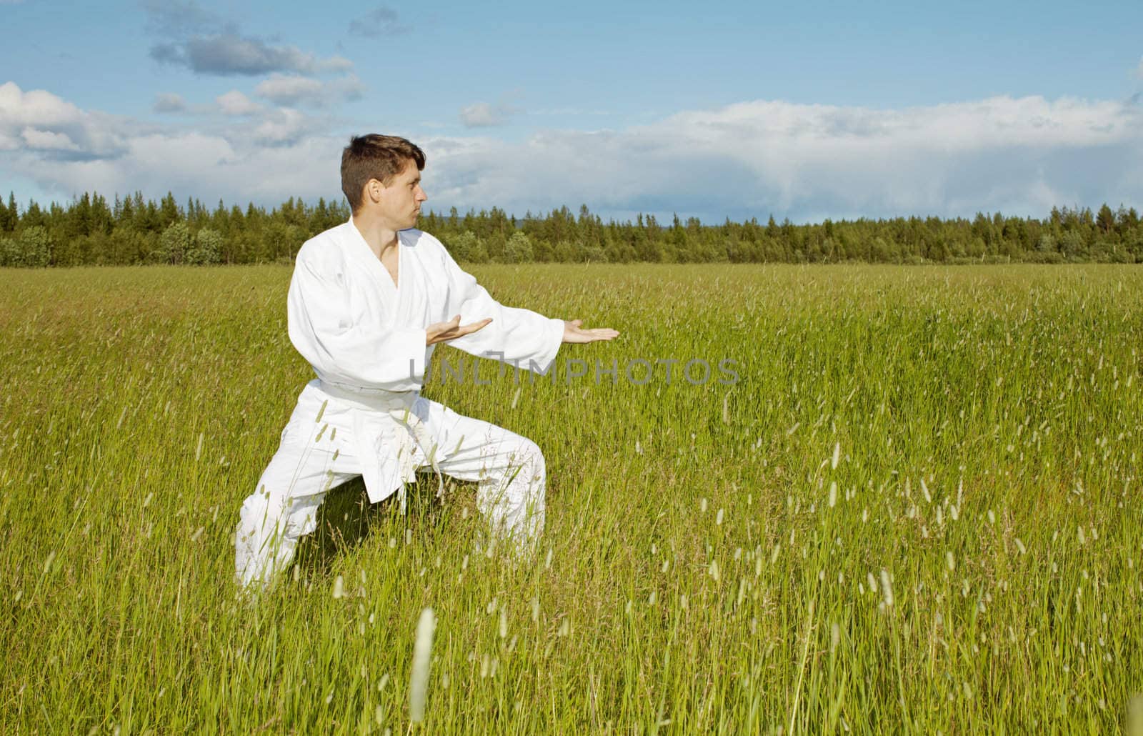 The young karateka trains in the open air