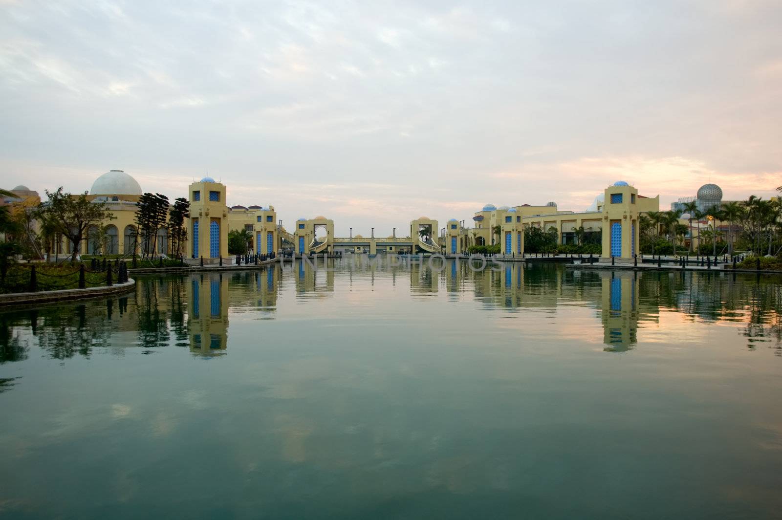 Panorama of water constructions with reflection over lake