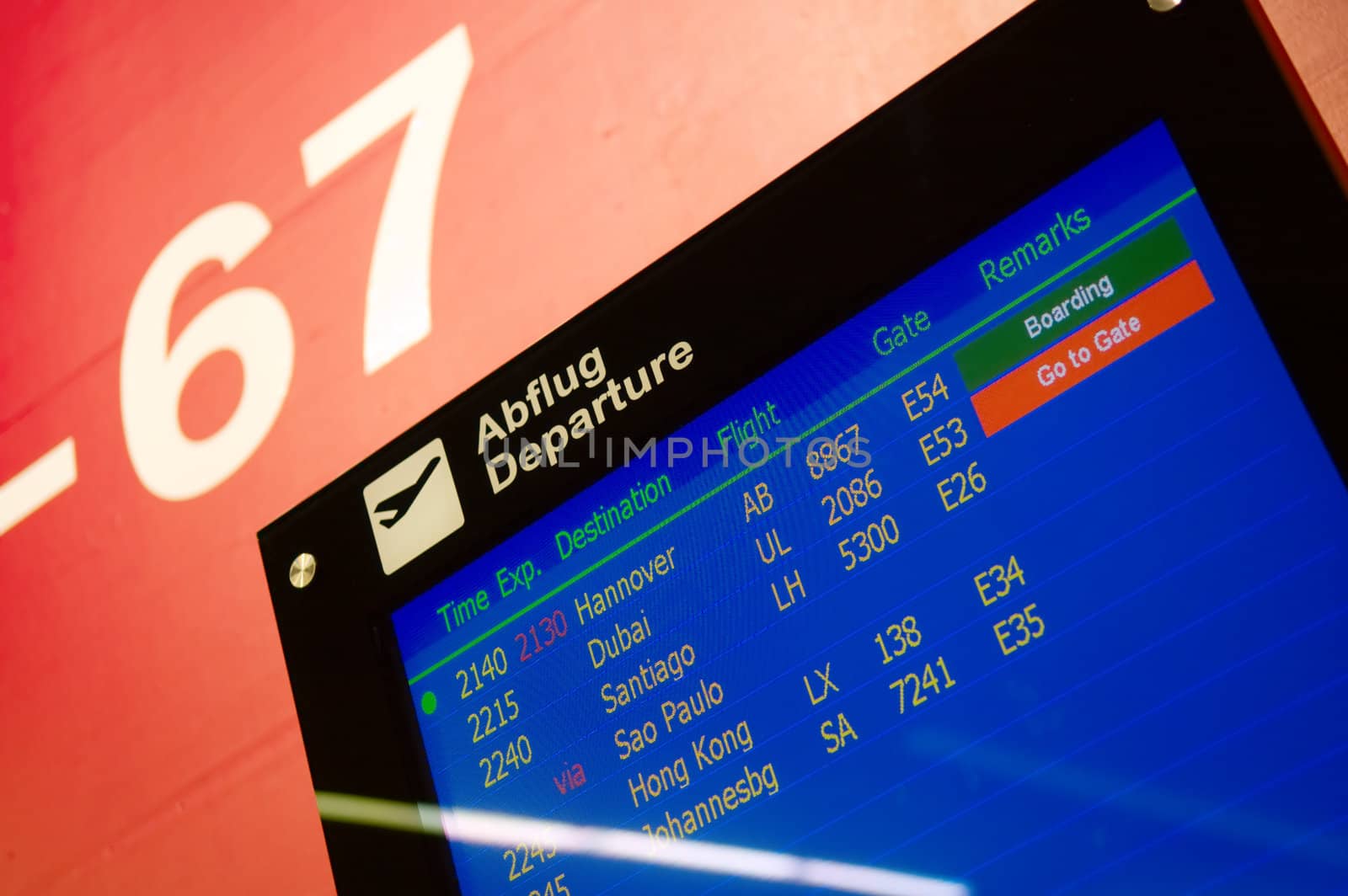 Airport information board showing arrivals and departures on time
