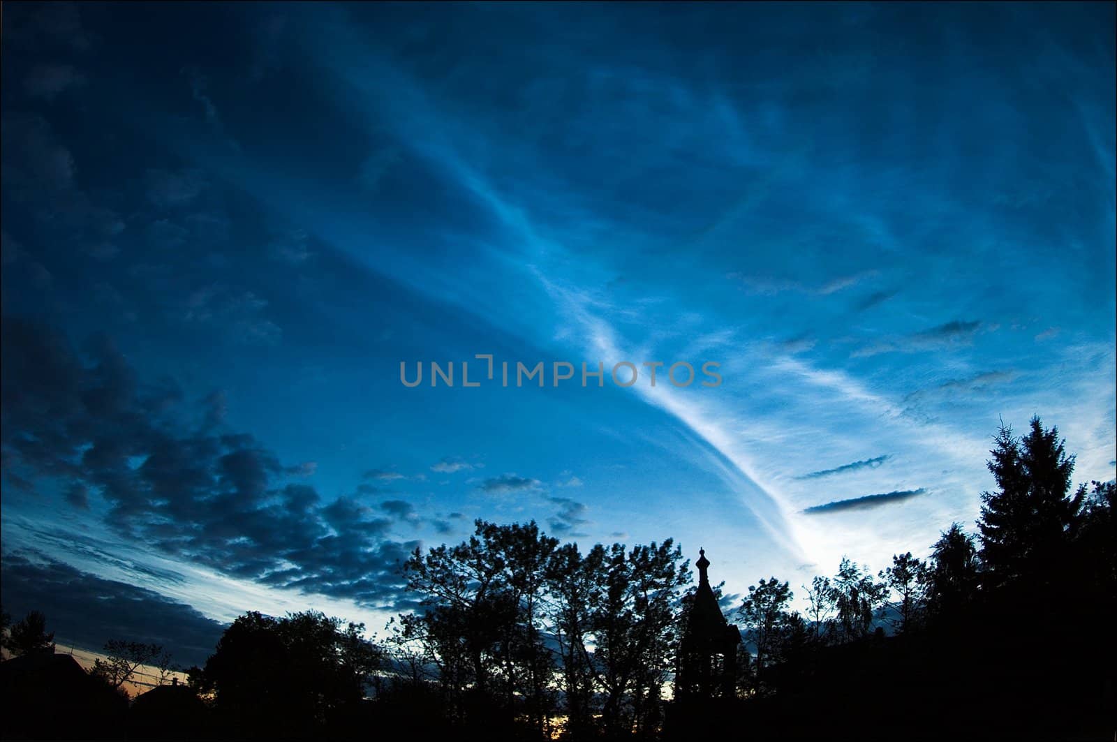 Silver clouds. An unusual occurrence around the white nights. Very high clouds are shone silver light against the night summer sky.