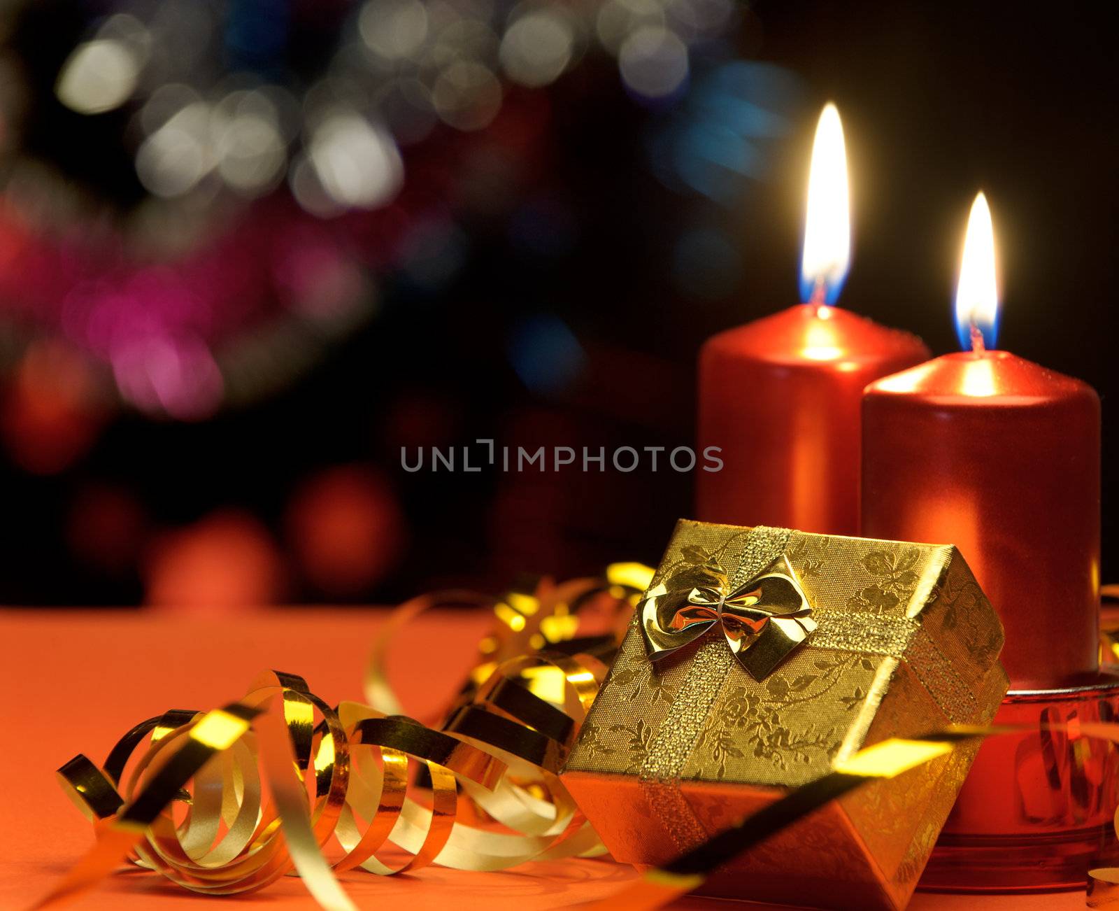 Christmas candles and gift boxes. A celebratory composition