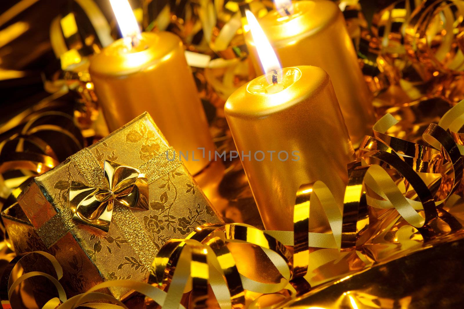 Christmas candles and gift boxes. Gold color