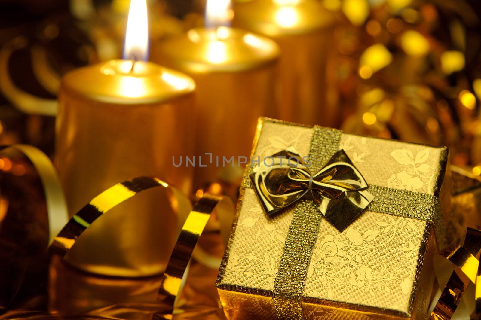 Christmas candles and gift boxes. Gold color