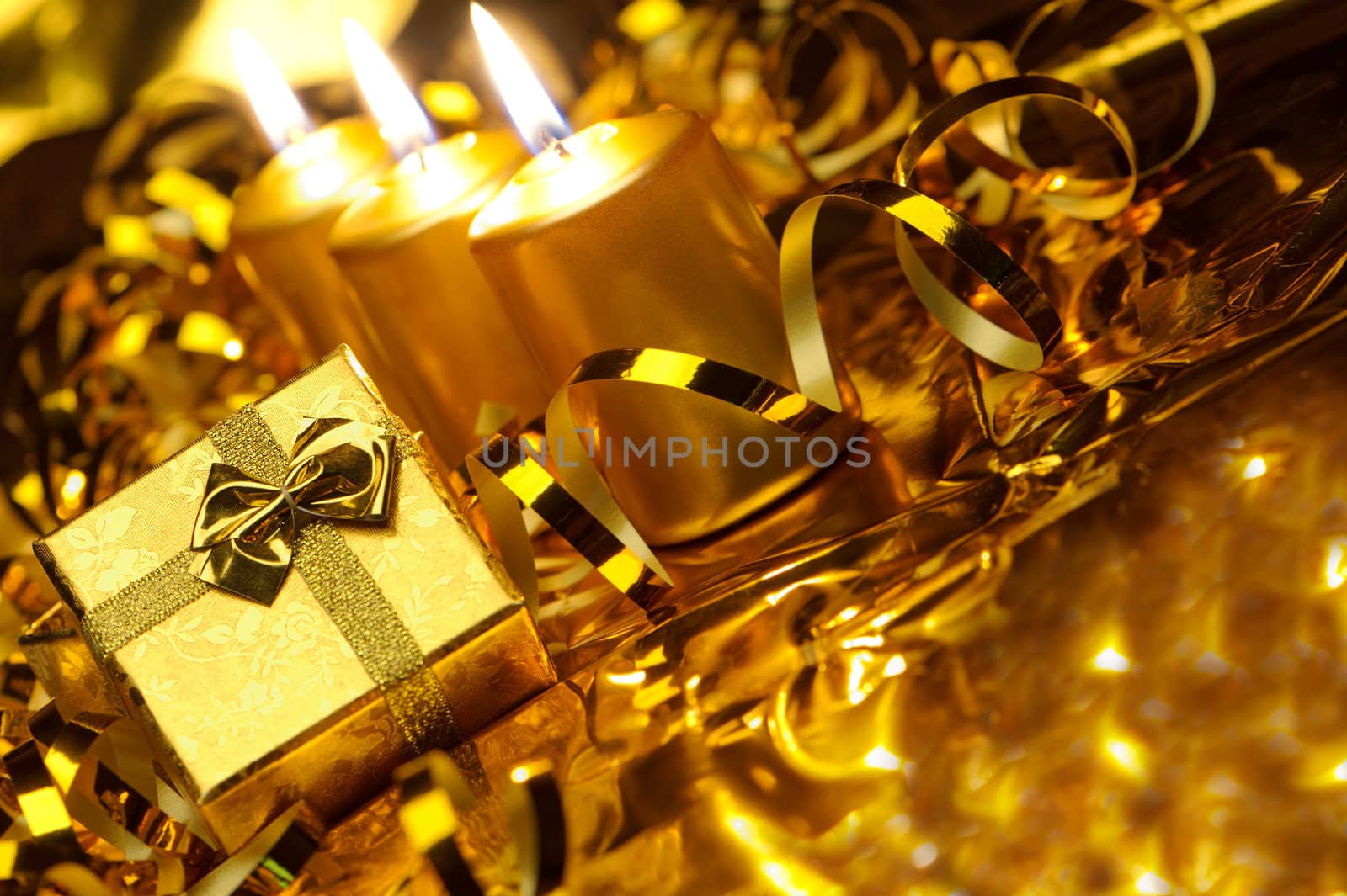 Christmas candles and gift boxes. Gold color