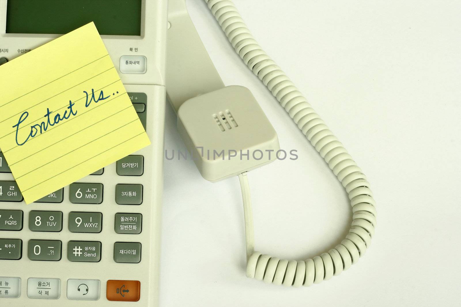 Contact us sign concept with a yellow post it