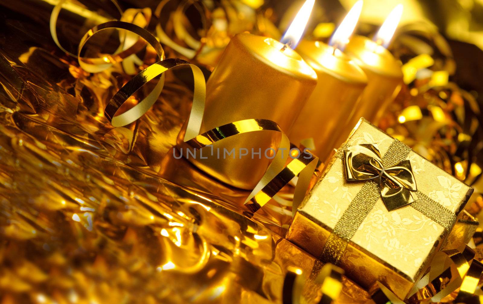 Christmas candles and gift boxes. Gold color