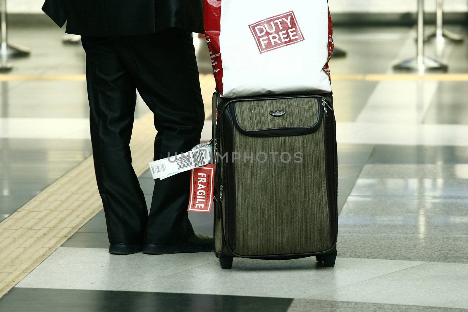 Businessman with suitcase concept for travel and tourism