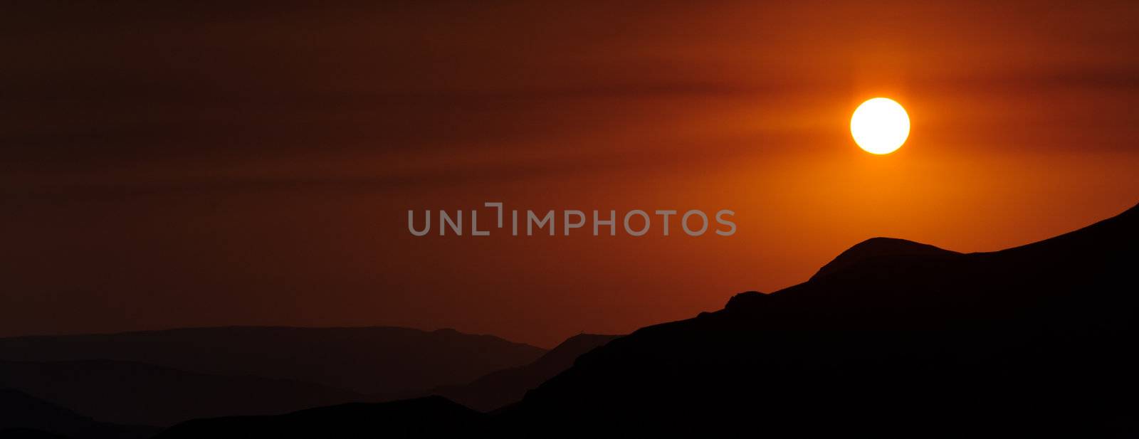 Colourful decline over mountains. Red colour