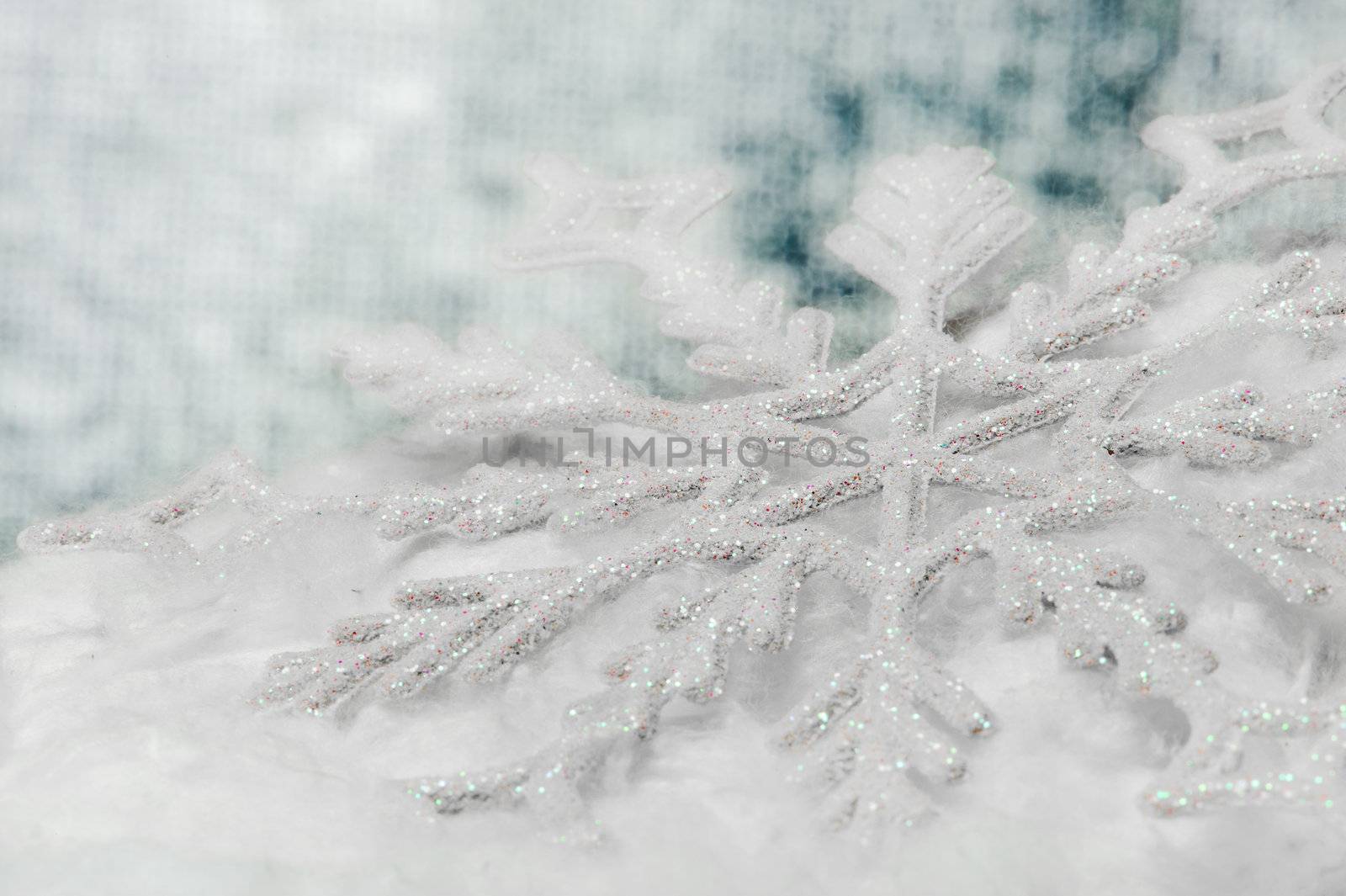 Snowflake big close up. Bokeh a background. Toning is blue