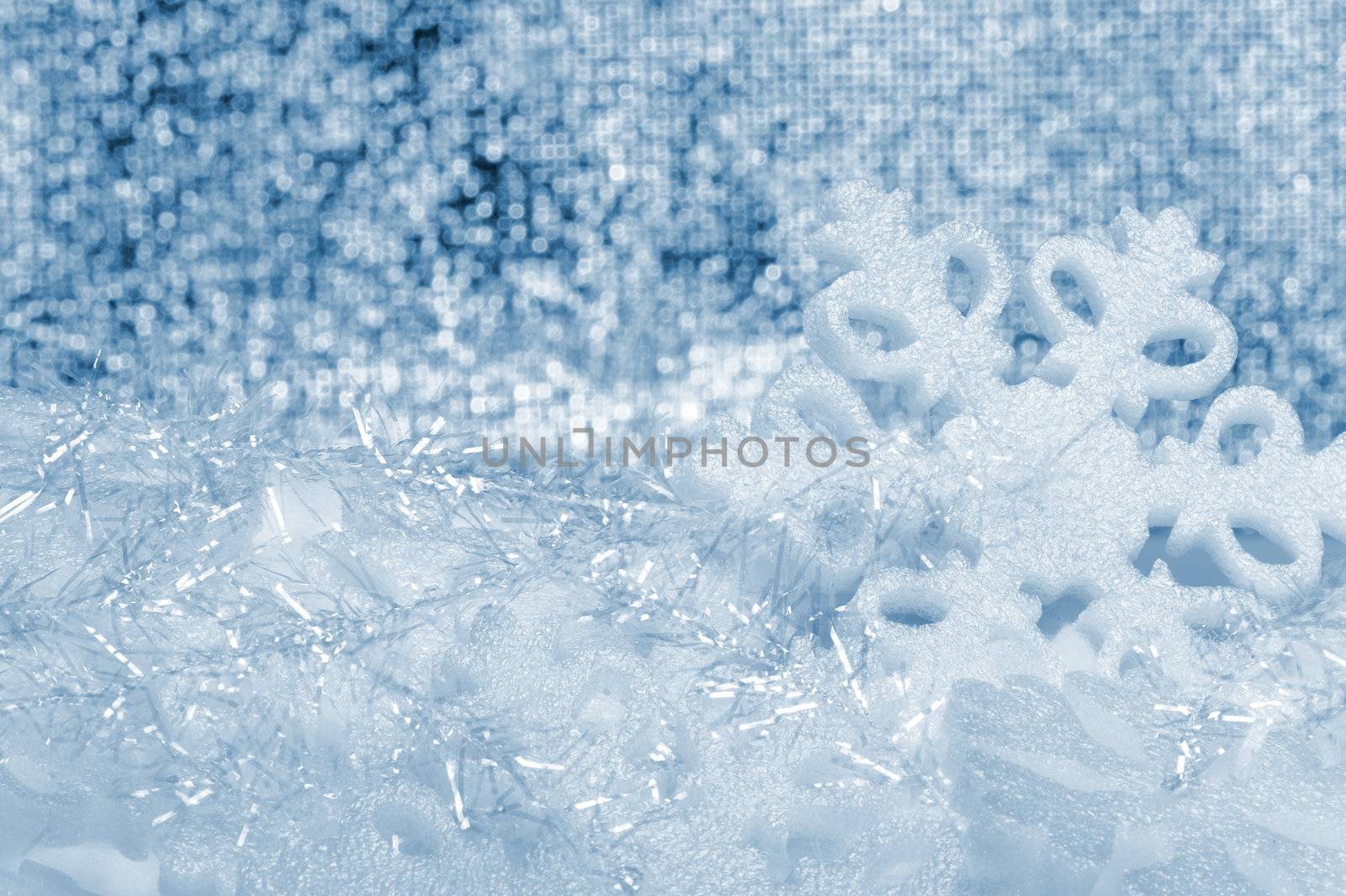 Snowflake big close up. Bokeh a background. Toning is blue